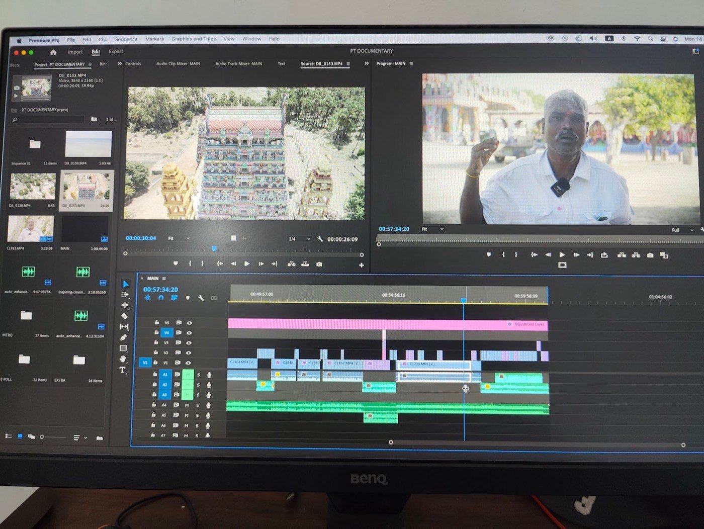 A documentary edit in Premiere Pro with drone footage of a temple gopuram and an interview