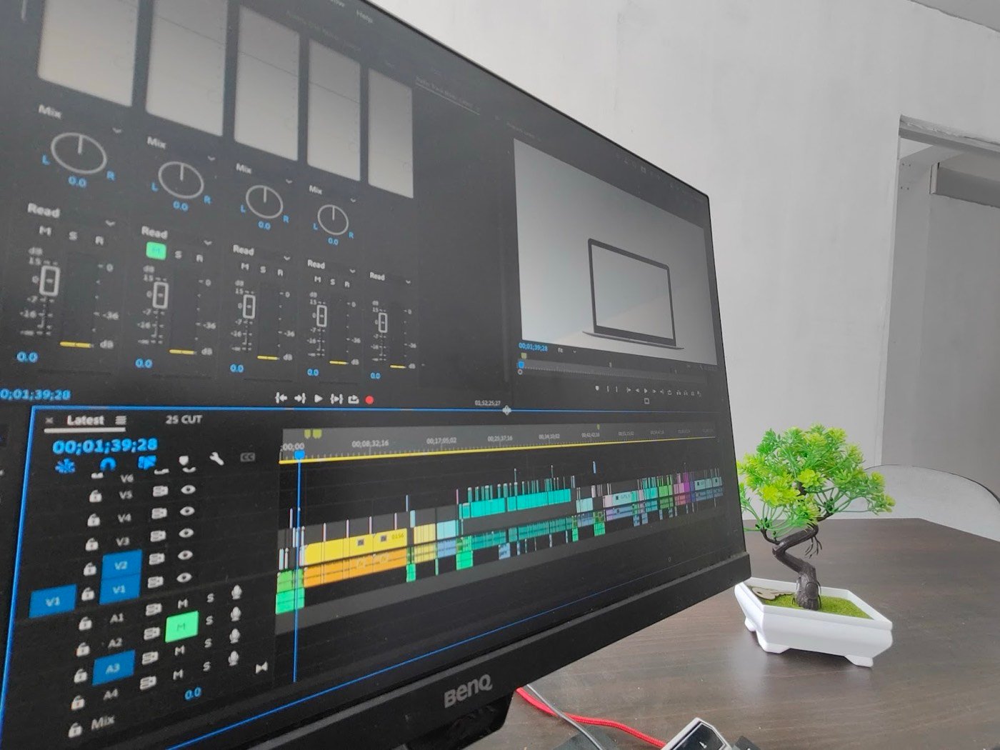 Editing timeline and audio mixer on a studio monitor