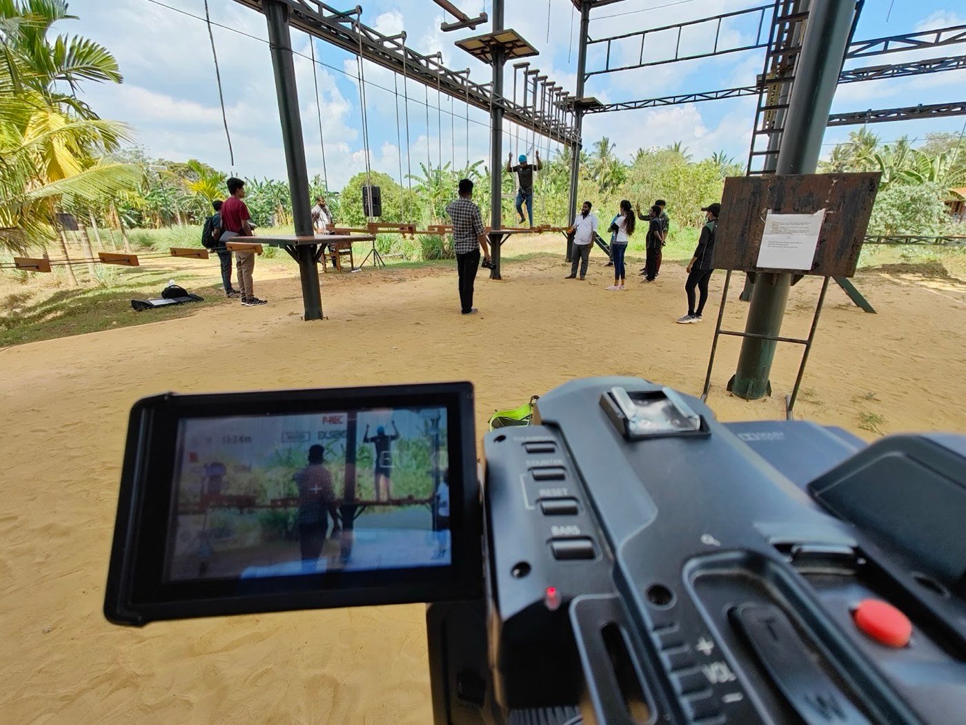Camera monitor recording a team activity on a ropes course